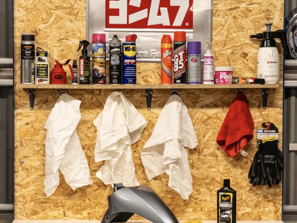 Cleaning and care products on the workshop prep bench
